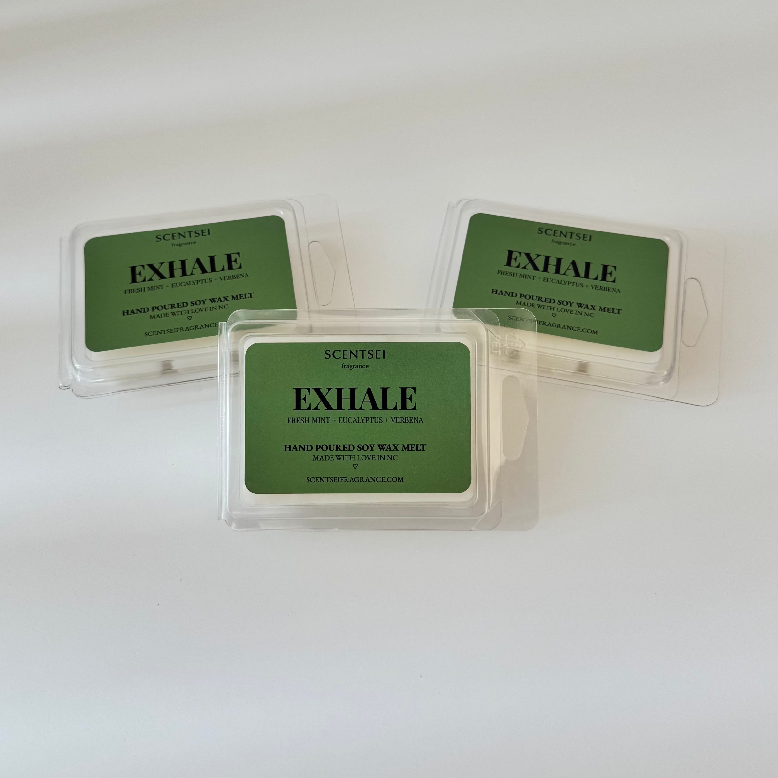 Three Scentsei Fragrance wax melts labeled 'EXHALE' on a white background